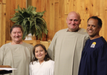 Jaime Rodriguez (right), pastor of the Summersville church, introduces baptismal candidates Amy Perdue (left), Brayleigh Lafferty and Jackie Perdue to the congregation. Photo by Jenny Rodriguez